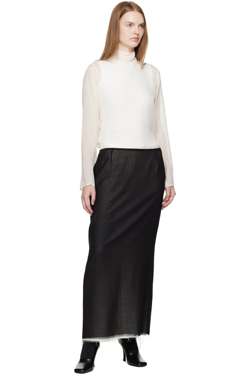 Virgin wool crêpe midi skirt.

· Layered construction
· Raw edge at hem
· Zip closure at side seam
· Central vent at back hem
· Full silk crêpe lining

Supplier color: Black/Off white