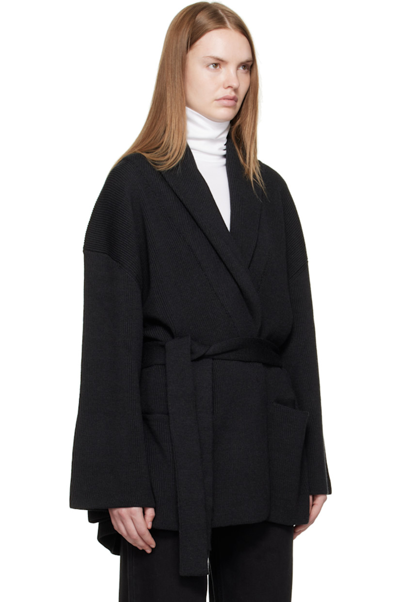 Rib-knit virgin wool cardigan.

· Shawl lapel
· Open front
· Belt loops and self-tie belt
· Welt pockets at front

Supplier color: Dark grey