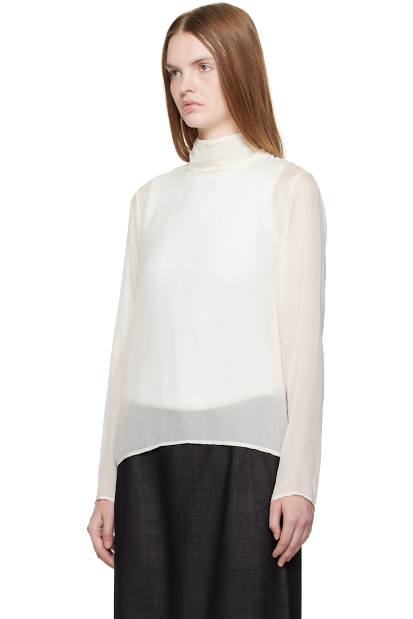 Sheer silk chiffon blouse.

· Button fastening at turtleneck
· Mother-of-pearl hardware

Supplier color: Off white