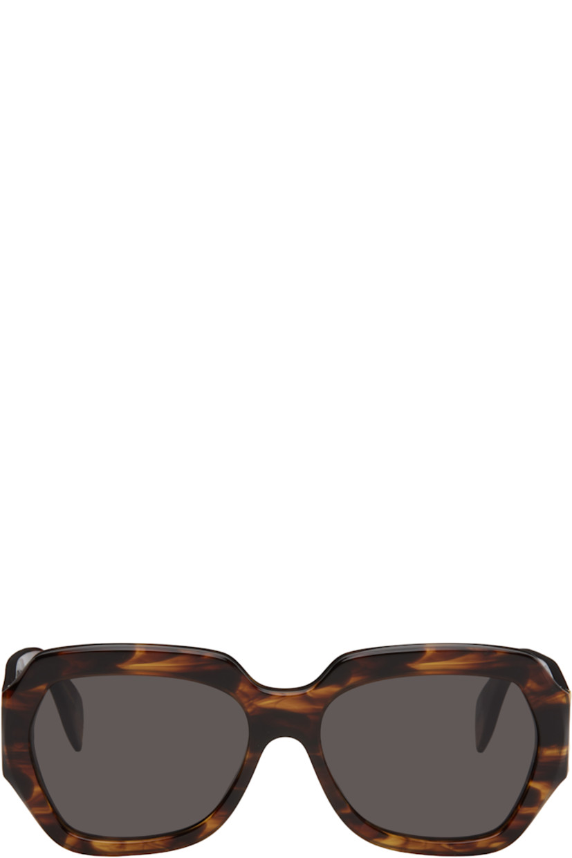 Handcrafted hexagonal semi-transparent tortoiseshell acetate-frame sunglasses in brown.

· Gray Zeiss lenses
· Integrated nose pads
· Inset logo hardware at temples
· Exposed core wires
· Includes pouch
· Size: 58.17 145

Supplier color: Havana striata