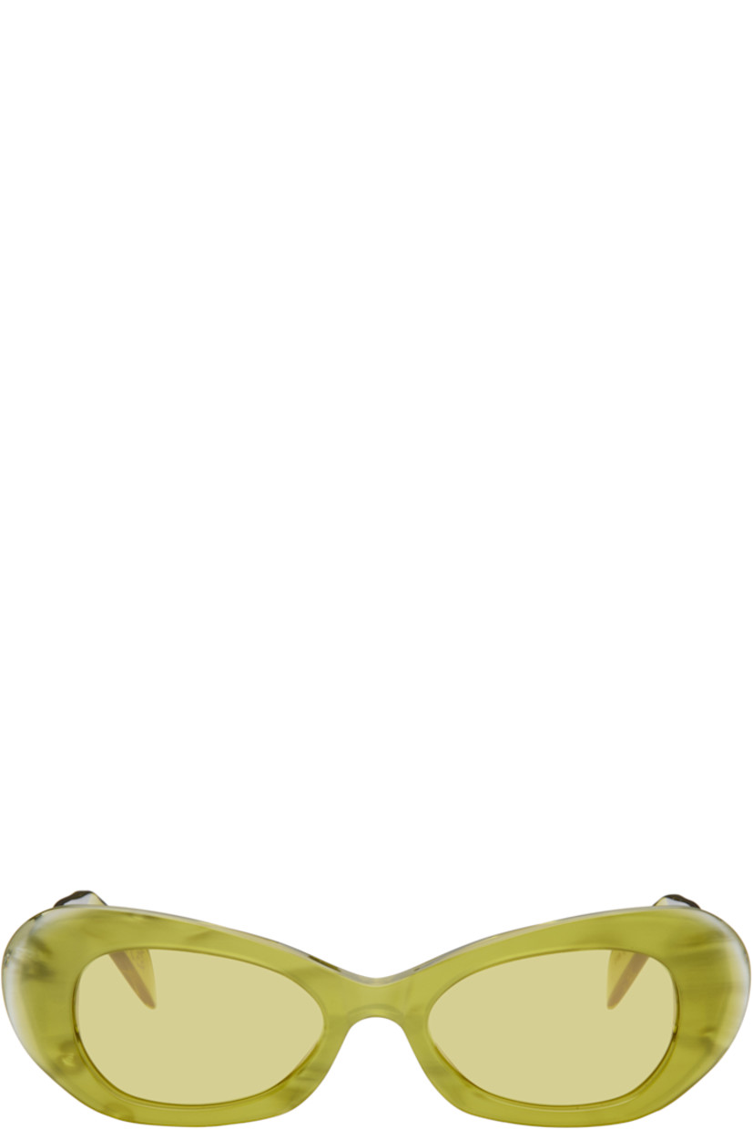 Oval semi-transparent acetate-frame sunglasses in yellow.

· Handcrafted
· Marbled pattern throughout
· Yellow lenses, category 1
· Integrated nose pads
· Logo hardware at temples
· Exposed core wires
· Includes pouch
· Size: 52.19 145

Supplier color: Mindless
