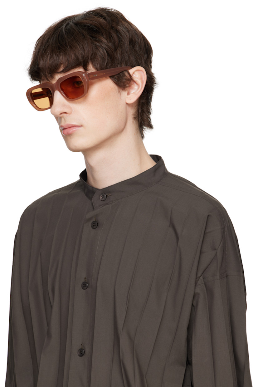 Rectangular semi-transparent acetate-frame sunglasses in brown.

· Handcrafted
· Brown lenses, category 2
· Integrated nose pads
· Rivets and inset logo hardware at temples
· Exposed core wires
· Includes pouch
· Size: 54.20 145

Supplier color: Cola