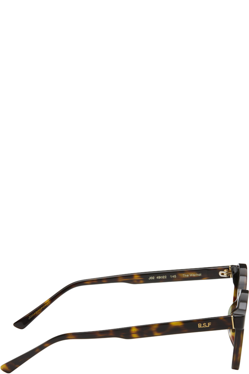 Handcrafted round tortoiseshell acetate-frame sunglasses in tones of brown.

· Green lenses
· Keyhole bridge
· Integrated nose pads
· Exposed core wires
· Gold-tone hardware
· Includes pouch
· Size: 49.22 145

Part of the Andy Warhol capsule.

Supplier color: Havana