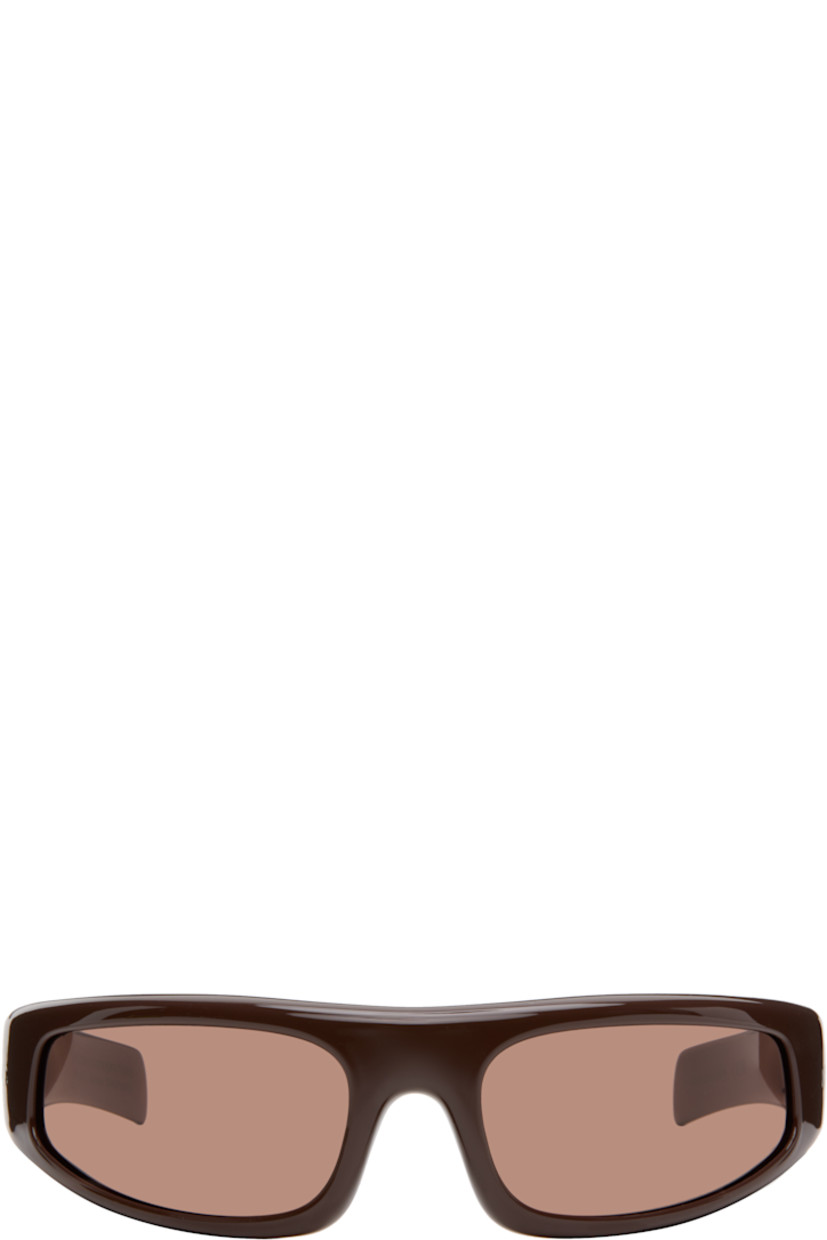 Wraparound acetate-frame sunglasses.

· Brown lenses
�· Integrated nose pads
· Fixed temples, hingeless
· Inset logo hardware at temples
· Includes pouch
· Size 76.22

Supplier color: Ciambella