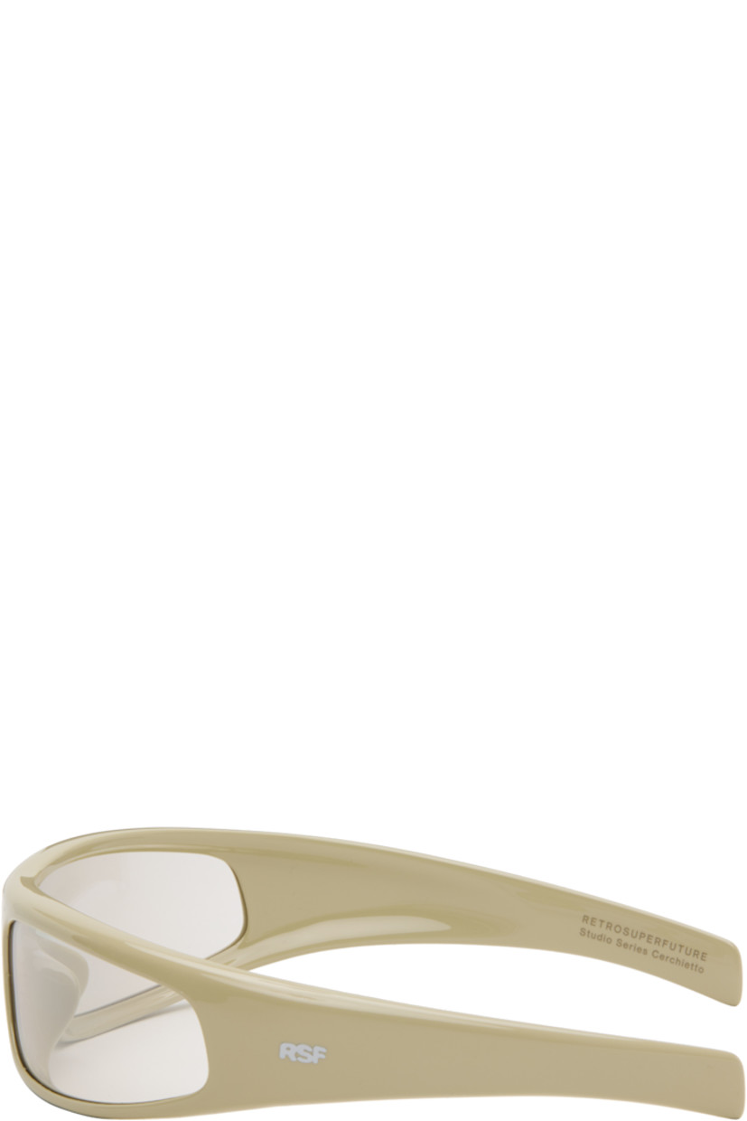 Wraparound acetate-frame sunglasses.

· Brown lenses
· Integrated nose pads
· Fixed temples, hingeless
· Inset logo hardware at temples
· Includes pouch
· Size 76.22

Supplier color: Cremoso