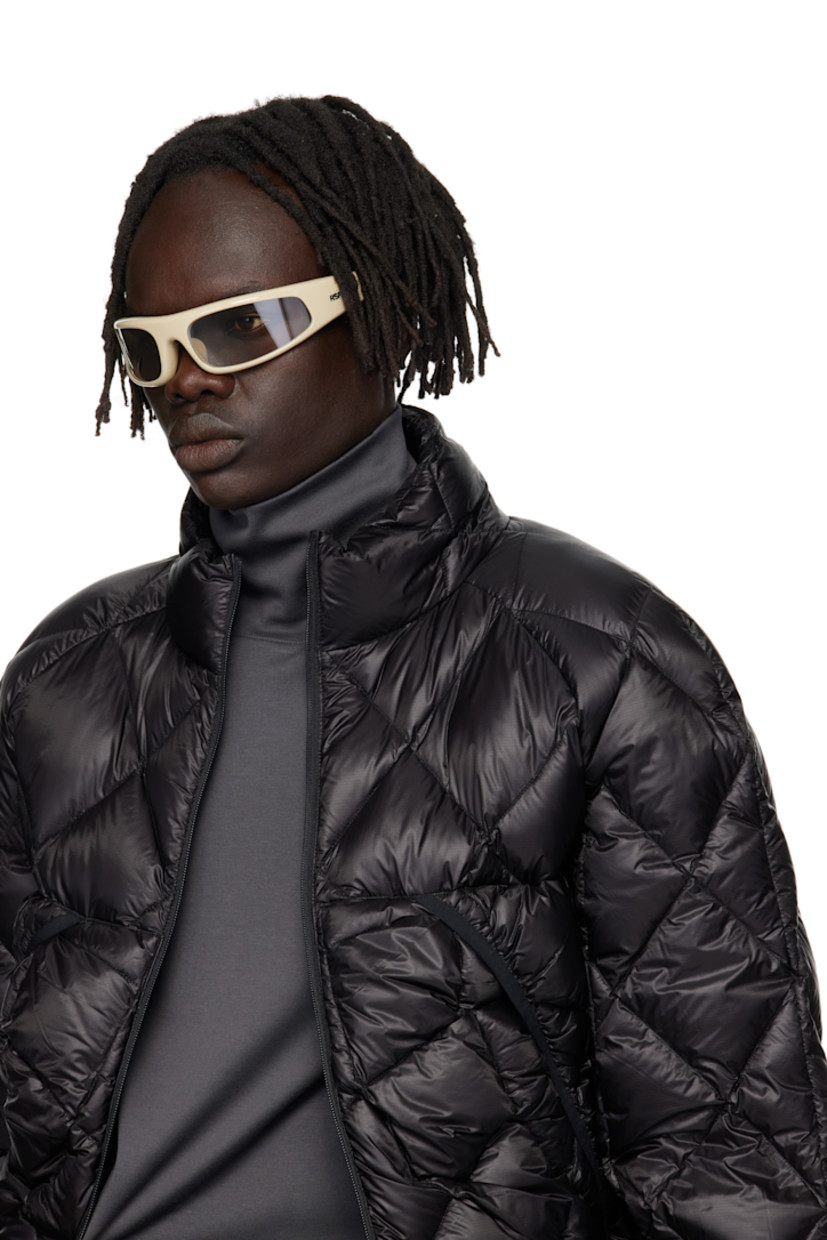 Wraparound acetate-frame sunglasses.

· Brown lenses
· Integrated nose pads
· Fixed temples, hingeless
· Inset logo hardware at temples
· Includes pouch
· Size 76.22

Supplier color: Cremoso