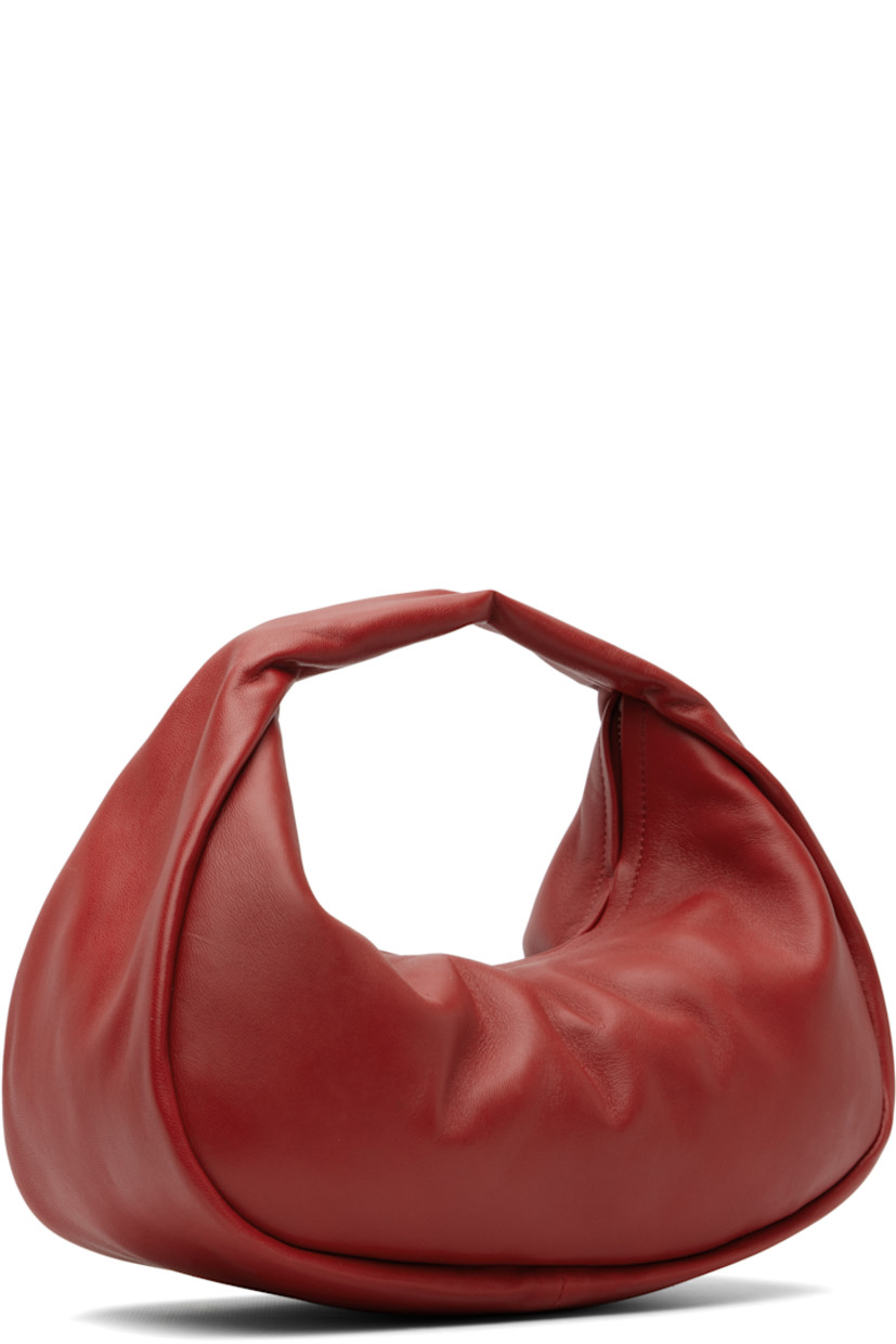 LWG-certified grained lambskin top handle bag.

· Integrated carry handle
· Zip closure
· Goatskin suede lining
· H8" x W11" x D4"

Supplier color: Rosso