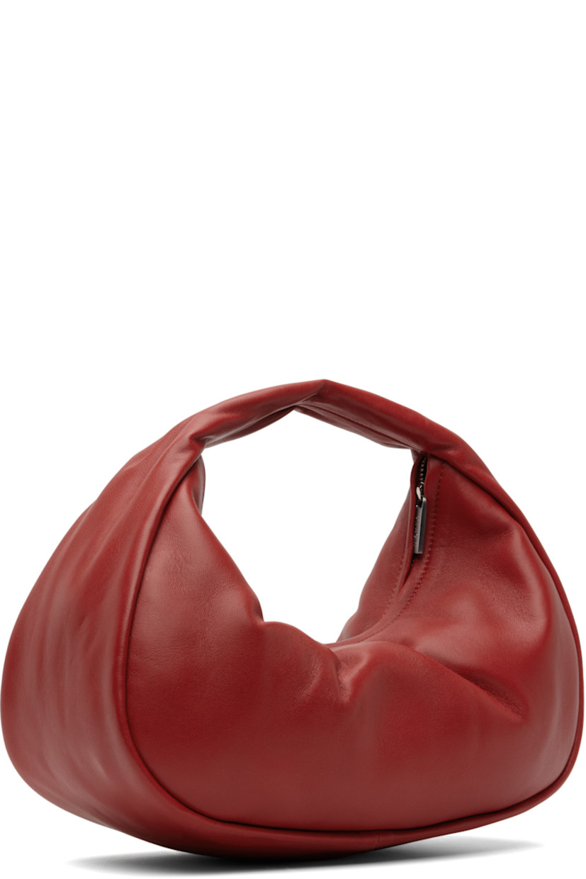 LWG-certified grained lambskin top handle bag.

· Integrated carry handle
· Zip closure
· Goatskin suede lining
· H8" x W11" x D4"

Supplier color: Rosso