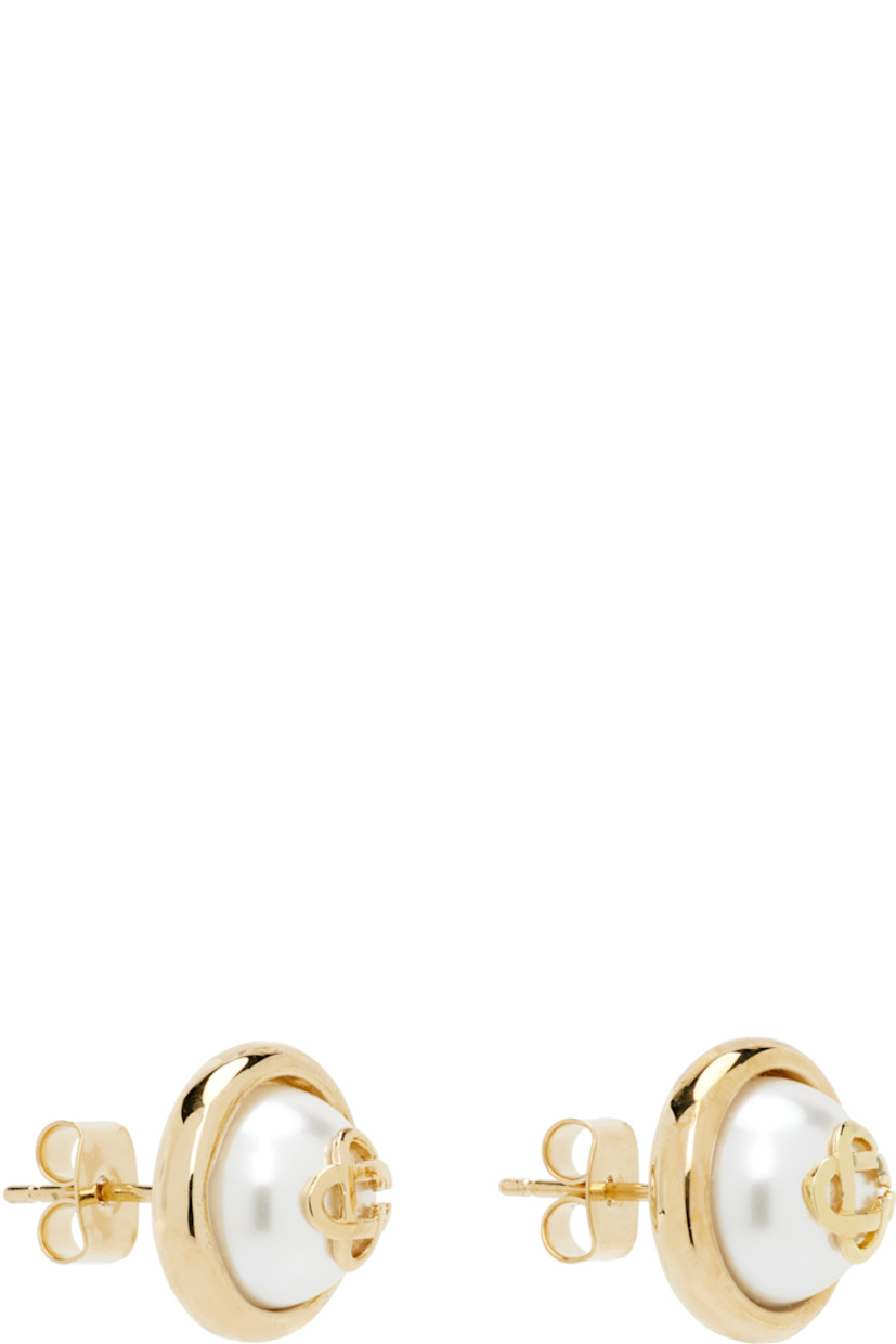Pair of stud earrings in 18k gold-plated brass.

· Logo and glass faux-pearl at face
· Post-stud fastening
· D0.5"

Supplier color: Gold/Pearl