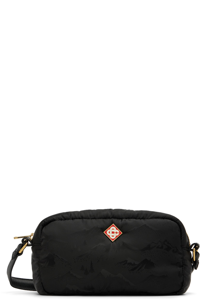 Padded nylon satin shoulder bag.

· Graphic pattern throughout
· Adjustable crossbody strap
· Logo plaque at face
· Zip closure
· Two card slots at interior
· Twill lining
· Logo-engraved gold-tone hardware
· H6" x W9" x D2.75"

Supplier color: Black