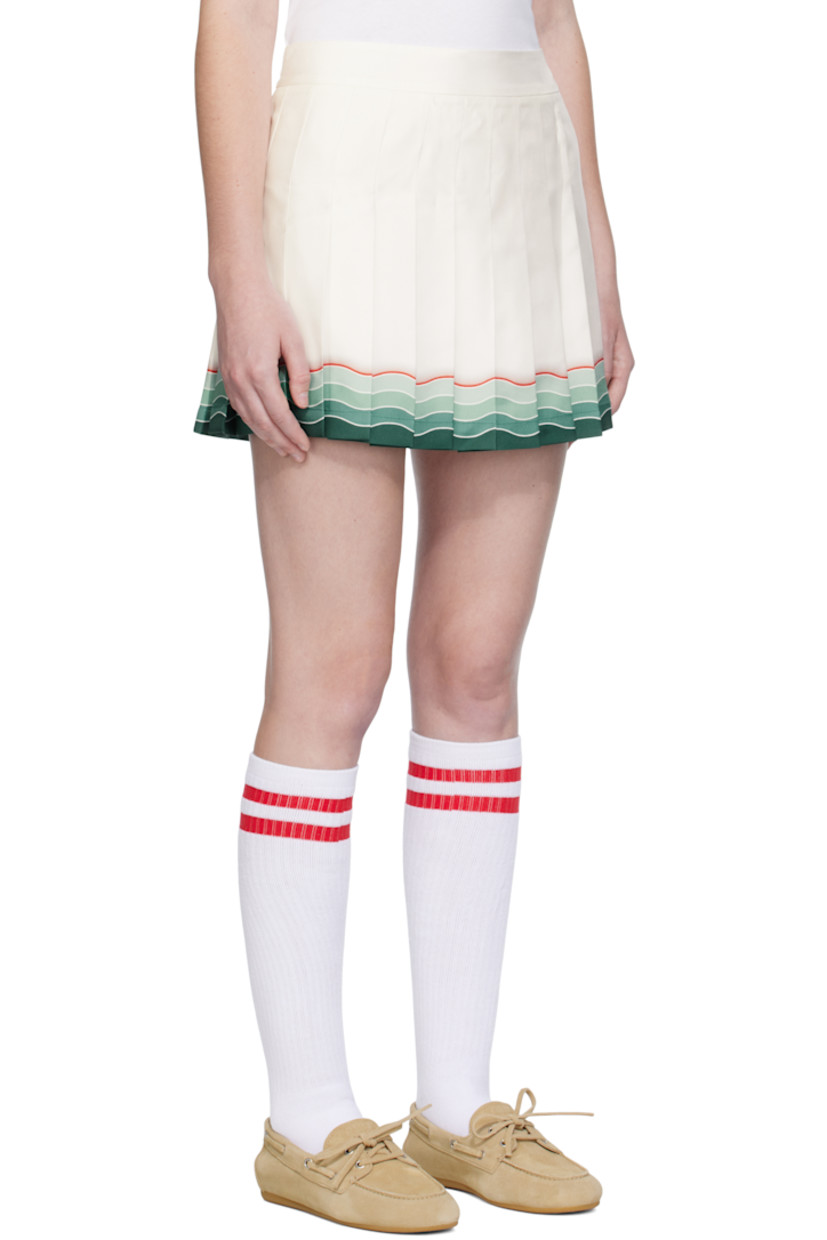 Silk twill miniskirt. 

· Knife pleats throughout
· Gradient stripes printed at hem
· Zip closure at side
· Full crêpe lining

Supplier color: White