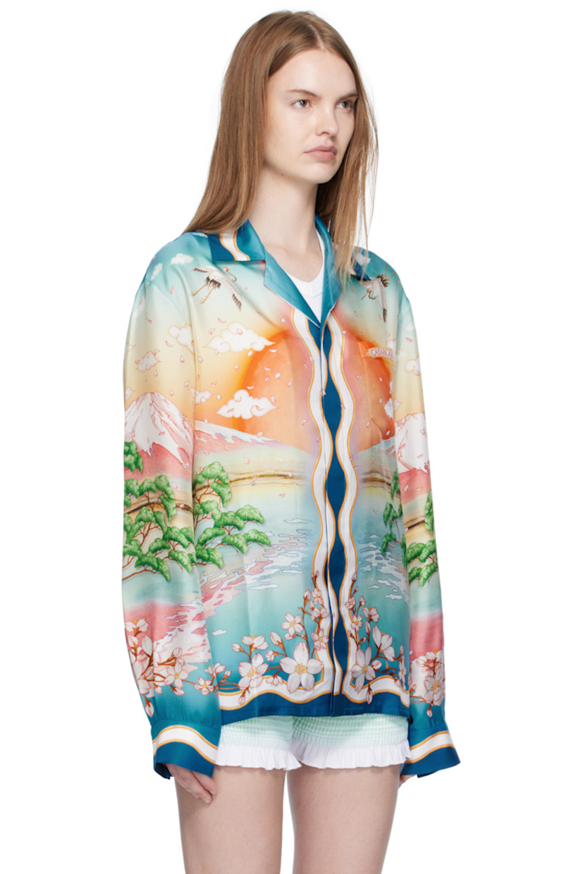 Silk satin shirt. 

· Graphics printed throughout
· Button fastening at open spread collar
· Concealed button closure
· Patch pocket at chest
· Logo printed at chest and back
· Buttoned barrel cuffs
· Logo-engraved hardware

Supplier color: Multicolour