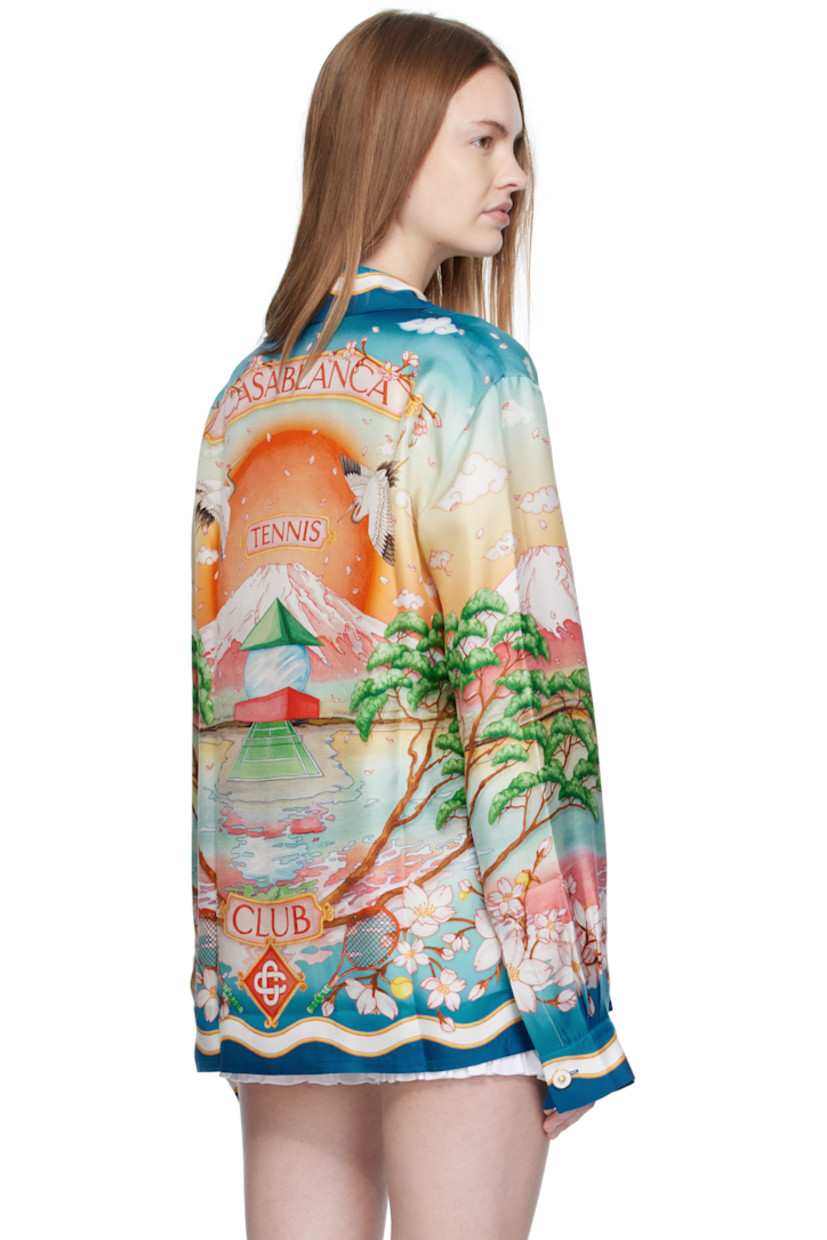 Silk satin shirt. 

· Graphics printed throughout
· Button fastening at open spread collar
· Concealed button closure
· Patch pocket at chest
· Logo printed at chest and back
· Buttoned barrel cuffs
· Logo-engraved hardware

Supplier color: Multicolour