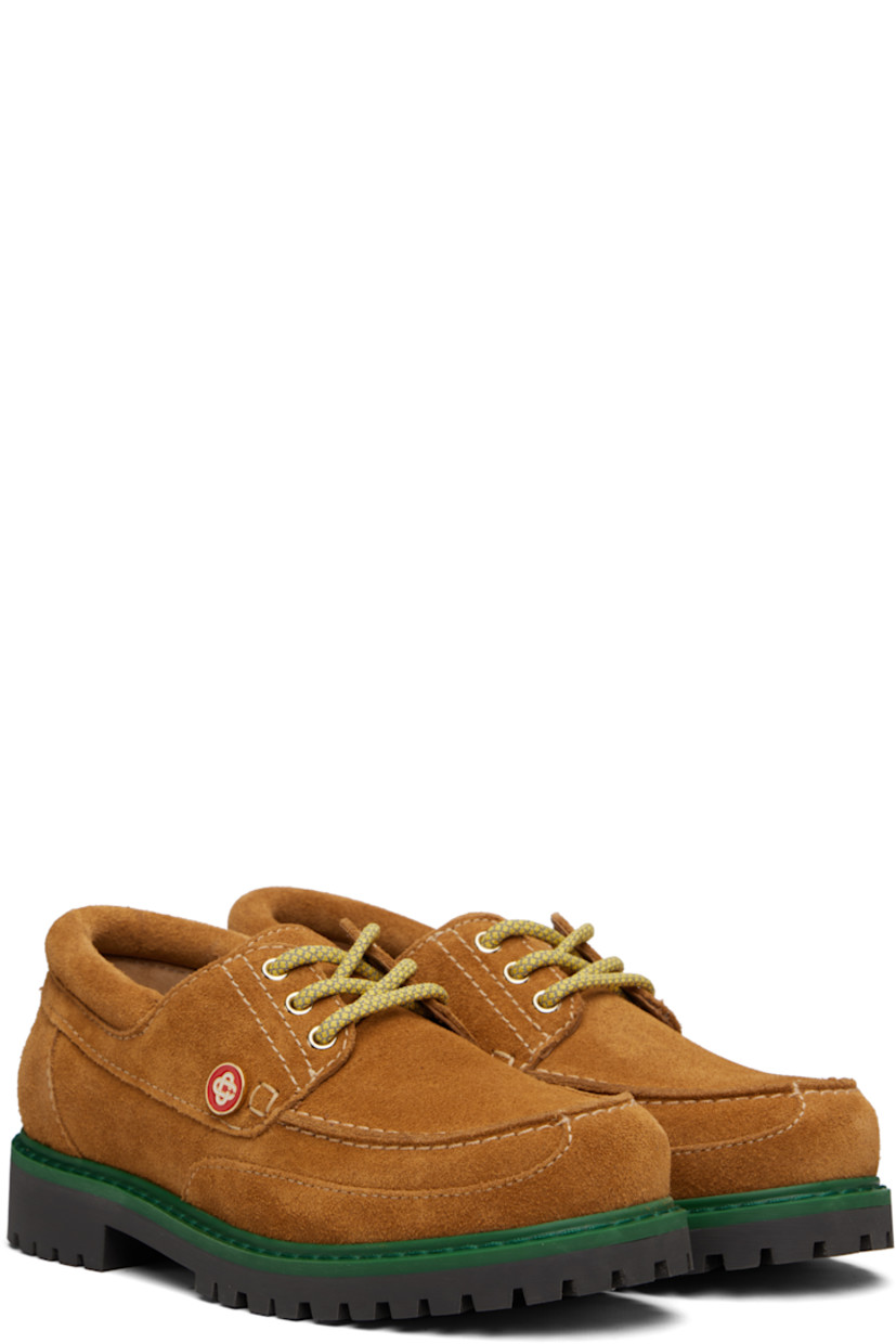 Suede derbys.
 
· Moc toe
· Lace-up closure
· Logo hardware at side
· Padded collar
· Leather lining
· Rubber welt and treaded sole
· Contrast stitching in off-white

Supplier color: Ecru