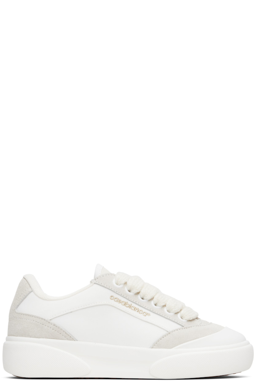 Low-top canvas and suede sneakers.

· Rubber cap toe
· Logo hardware at vamp
· Lace-up closure
· Text embroidered at padded tongue
· Padded collar
· Logo embroidered at outer side
· Mesh lining
· Treaded rubber sole

Supplier color: White