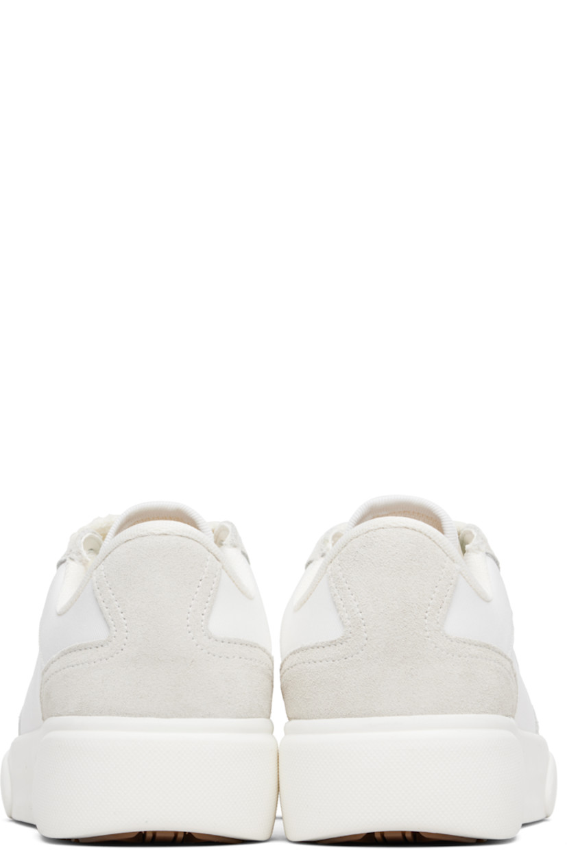 Low-top canvas and suede sneakers.

· Rubber cap toe
· Logo hardware at vamp
· Lace-up closure
· Text embroidered at padded tongue
· Padded collar
· Logo embroidered at outer side
· Mesh lining
· Treaded rubber sole

Supplier color: White