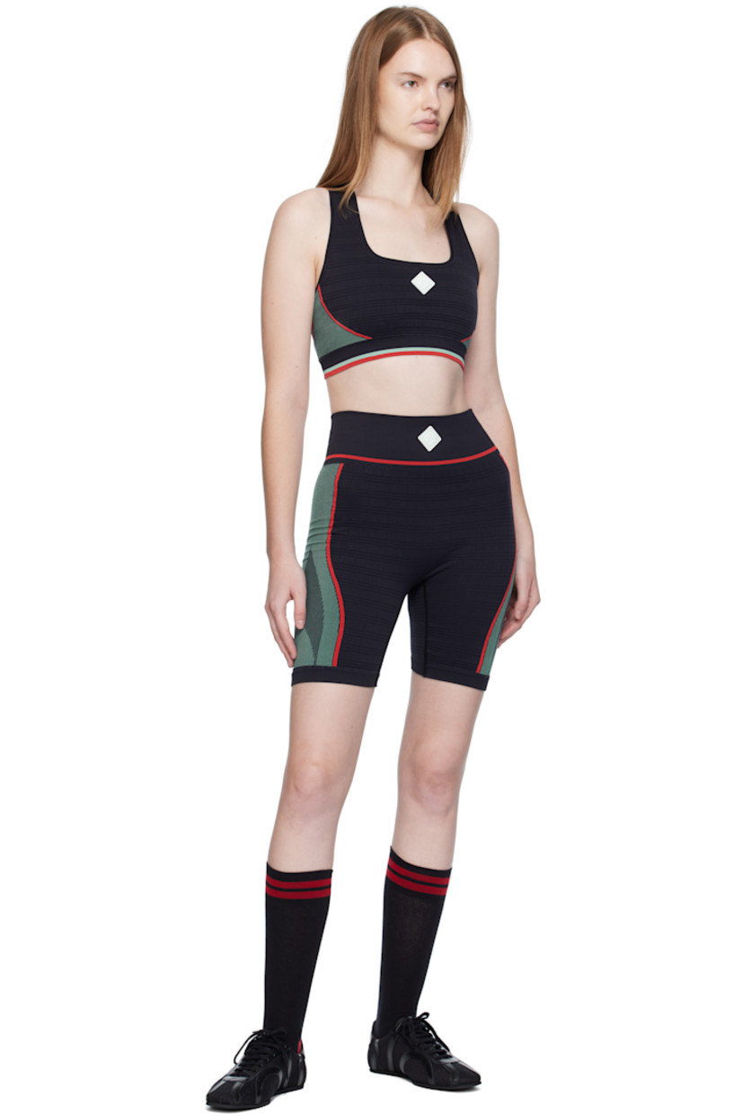 Stretch recycled nylon-blend jersey sport bra.

· Jacquard stripes and check pattern throughout
· Square neck
· Rubberized logo patch at chest
· Elasticized hem
· Racer back

Supplier color: Black