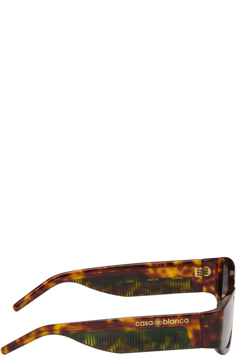 Rectangular semi-transparent tortoiseshell acetate-frame sunglasses.

· Green lenses
· 100% UVA/UVB protection
· Integrated nose pads
· Logo stamp at temples
· Exposed core wires
· Includes case
· Size: 57.16 140

Supplier color: Brown