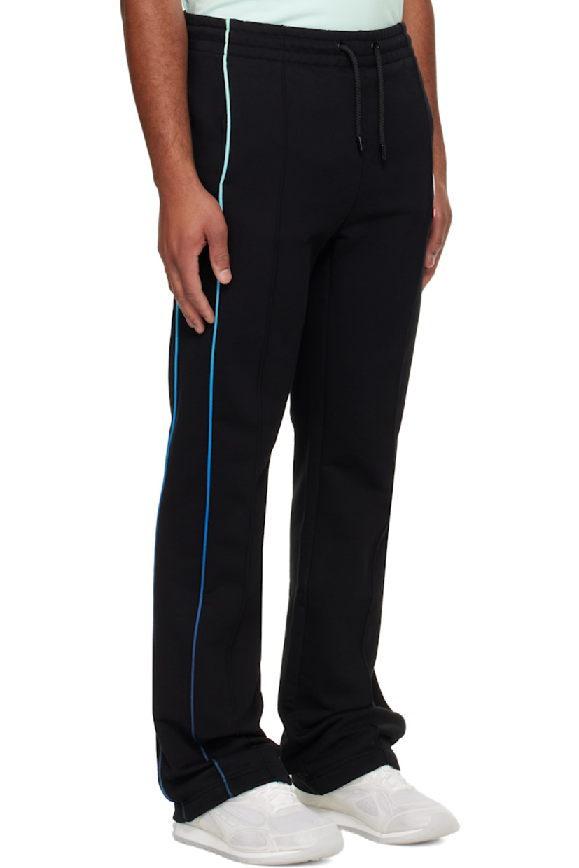 Organic cotton French terry sweatpants.

· Drawstring at elasticized waistband
· Two-pocket styling
· Rubber logo patches at front 
· Pinched seam at legs
· Gradient piping at outseams

Supplier color: Black