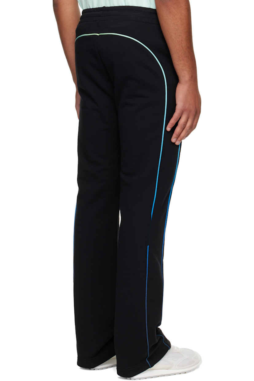 Organic cotton French terry sweatpants.

· Drawstring at elasticized waistband
· Two-pocket styling
· Rubber logo patches at front 
· Pinched seam at legs
· Gradient piping at outseams

Supplier color: Black
