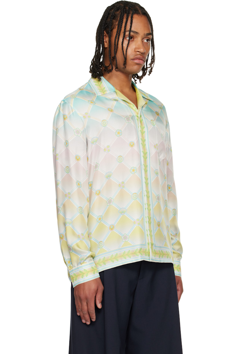 Silk twill shirt. 

· Logo graphic pattern printed throughout 
· Open spread collar 
· Concealed button closure 
· Patch pocket at chest 
· Buttoned barrel cuffs

Supplier color: Candy icons
