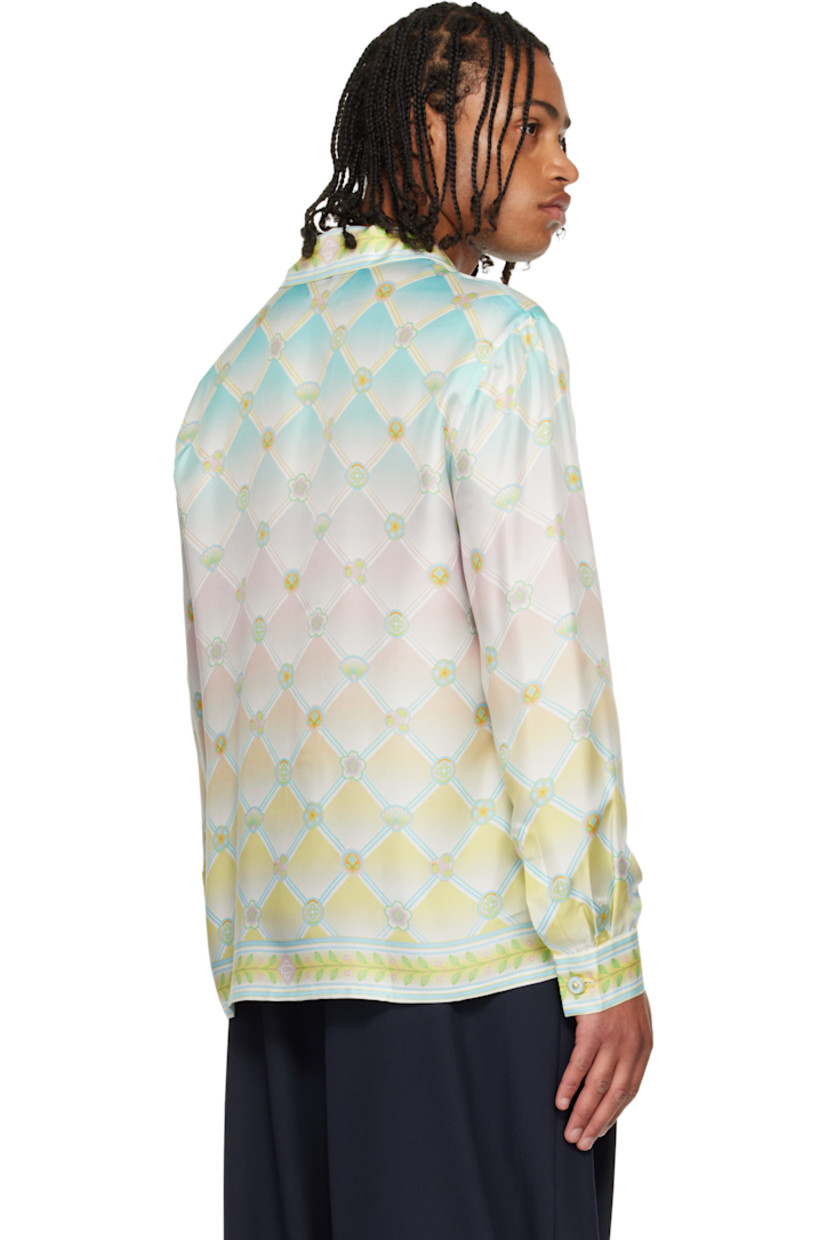 Silk twill shirt. 

· Logo graphic pattern printed throughout 
· Open spread collar 
· Concealed button closure 
· Patch pocket at chest 
· Buttoned barrel cuffs

Supplier color: Candy icons