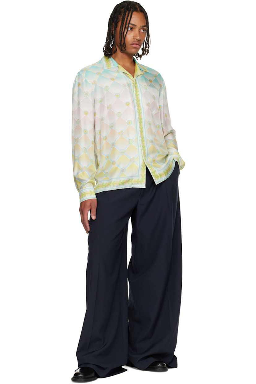 Silk twill shirt. 

· Logo graphic pattern printed throughout 
· Open spread collar 
· Concealed button closure 
· Patch pocket at chest 
· Buttoned barrel cuffs

Supplier color: Candy icons
