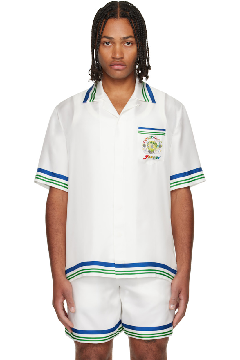 Silk twill shirt. 

· Stripes at collar, hem, and cuffs 
· Button tab at open spread collar 
· Button closure 
· Patch pocket at chest 
· Logo graphic printed at chest and back

Supplier color: White