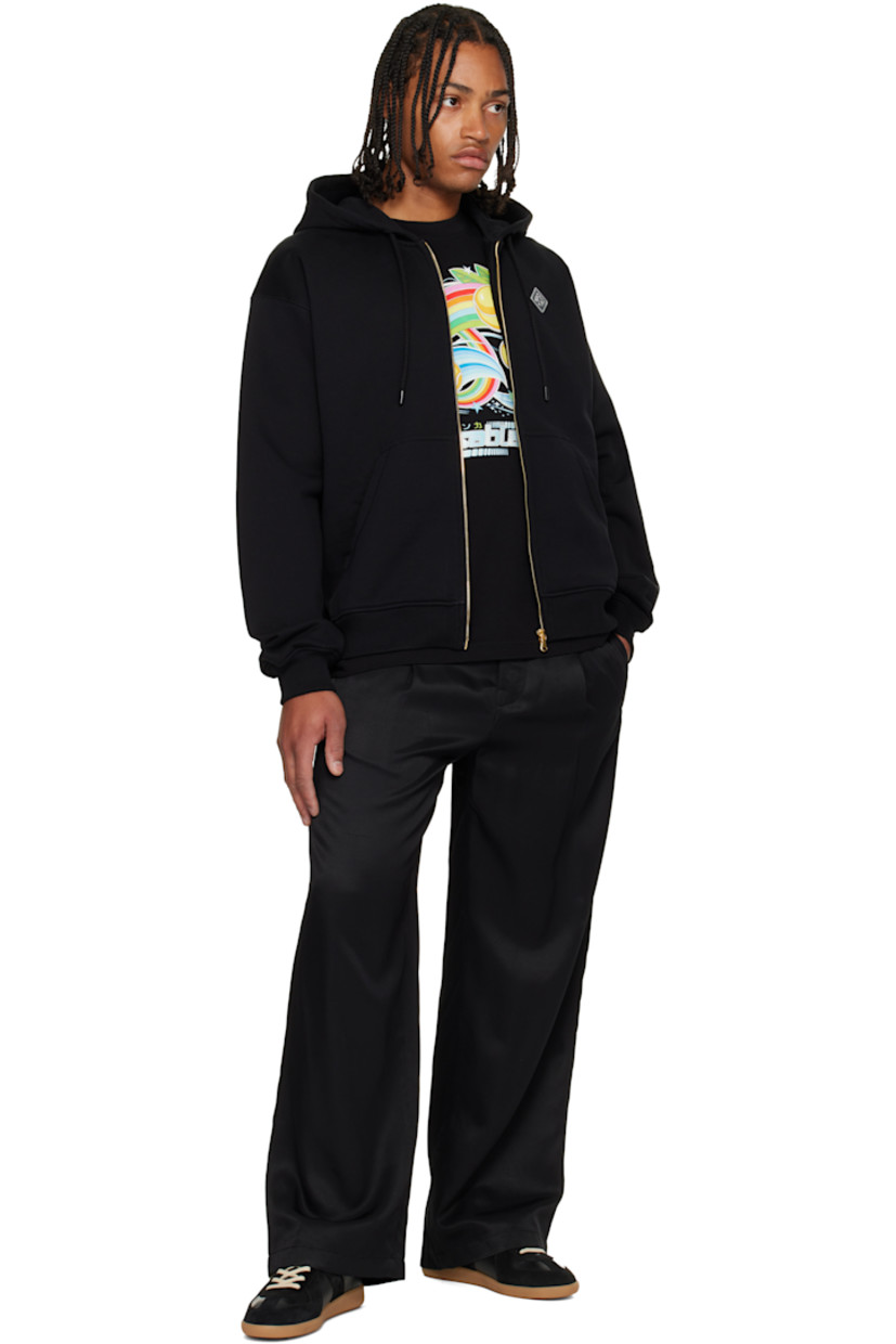Organic cotton French terry hoodie.

· Drawstring at hood
· Zip closure
· Rubber logo patch at chest 
· Patch pockets at front 
· Rib-knit hem and cuffs
· Dropped shoulders
· Logo bonded at back

Supplier color: Black