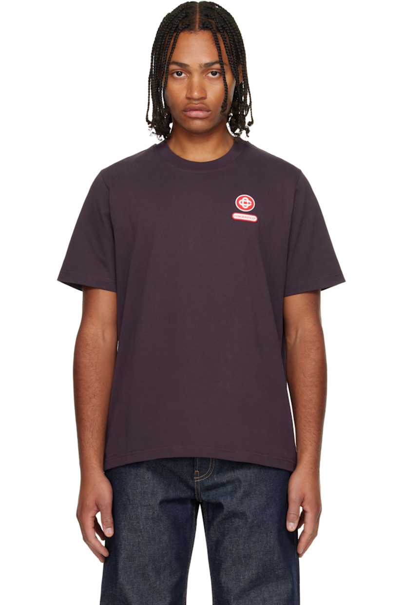 Organic cotton jersey T-shirt. 

· Rib-knit crewneck
· Rubber logo patches at chest and back collar

Supplier color: Burgundy