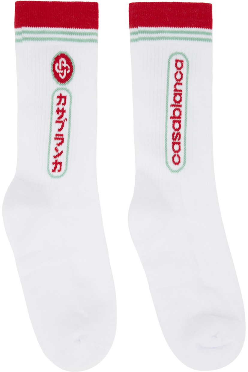 Pair of stretch cotton-blend jersey socks. 

· Rib-knit cuffs 
· Jacquard logo, text, and stripes at cuffs 

Supplier color: White