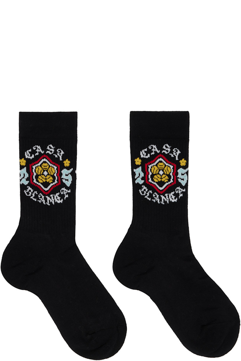 Pair of calf-high knit stretch cotton-blend socks. Jacquard logo graphic at rib-knit cuffs.

Supplier color: Black