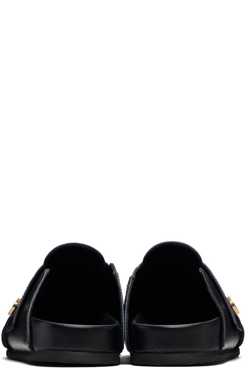 Pebble-grained calfskin and calfskin suede slip-on loafers.

· Strap with enameled logo hardware at vamp· 
· Buffed leather lining
· Treaded rubber sole

Supplier color: Black leather