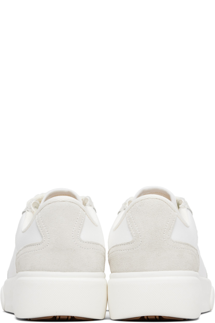 Low-top canvas and suede sneakers.

· Rubber cap toe
· Logo hardware at vamp
· Lace-up closure
· Text embroidered at padded tongue
· Padded collar
· Logo embroidered at outer side
· Mesh lining
· Treaded rubber sole

Supplier color: White