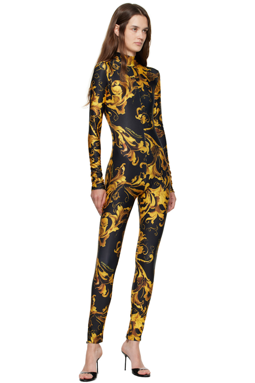 Stretch jersey jumpsuit.

· Barocco pattern printed throughout
· Stand collar
· Zip closure at back

Supplier color: Black/Gold