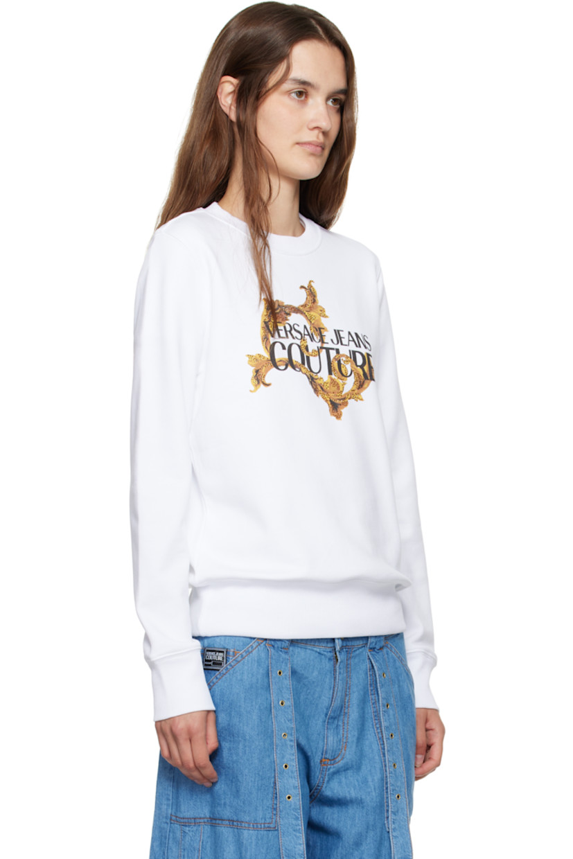French terry sweatshirt. 

· Rib-knit crewneck, hem, and cuffs
· Logo graphic with crystal-cut accents at front

Supplier color: White/Gold