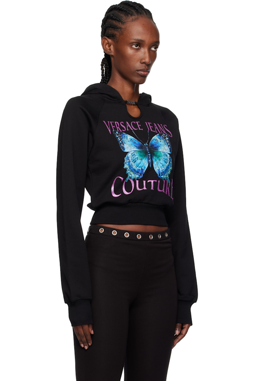 French terry hoodie.

· Logo hardware and cutout at collar
· Rib-knit hem and cuffs
· Raglan sleeves
· Logo graphic with crystal-cut accents at front

Supplier color: Black