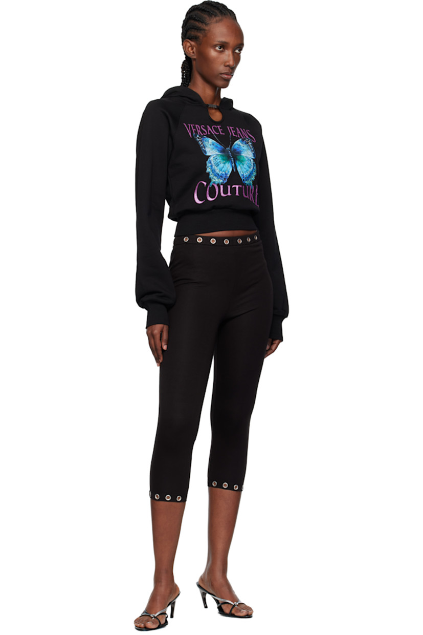 French terry hoodie.

· Logo hardware and cutout at collar
· Rib-knit hem and cuffs
· Raglan sleeves
· Logo graphic with crystal-cut accents at front

Supplier color: Black
