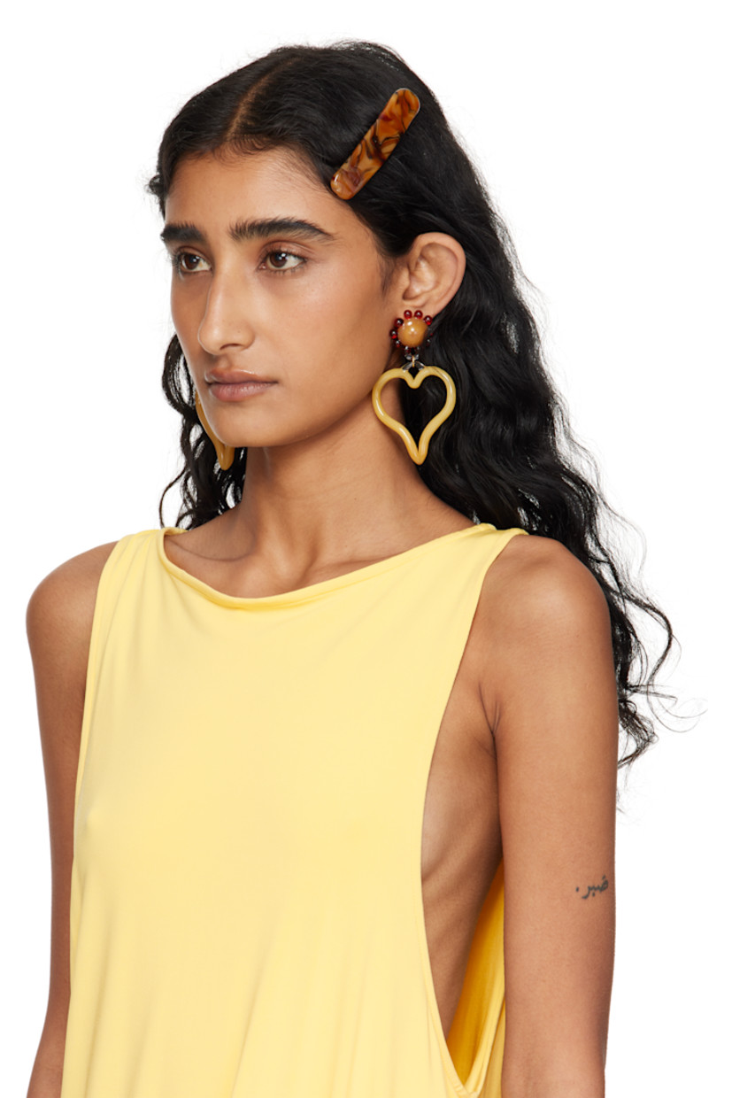 Brass barrette in silver tone. 

· Handcrafted borosilicate glass face
· Barrette fastening 
· H0.75" x W3.5"

Supplier color: Yellow