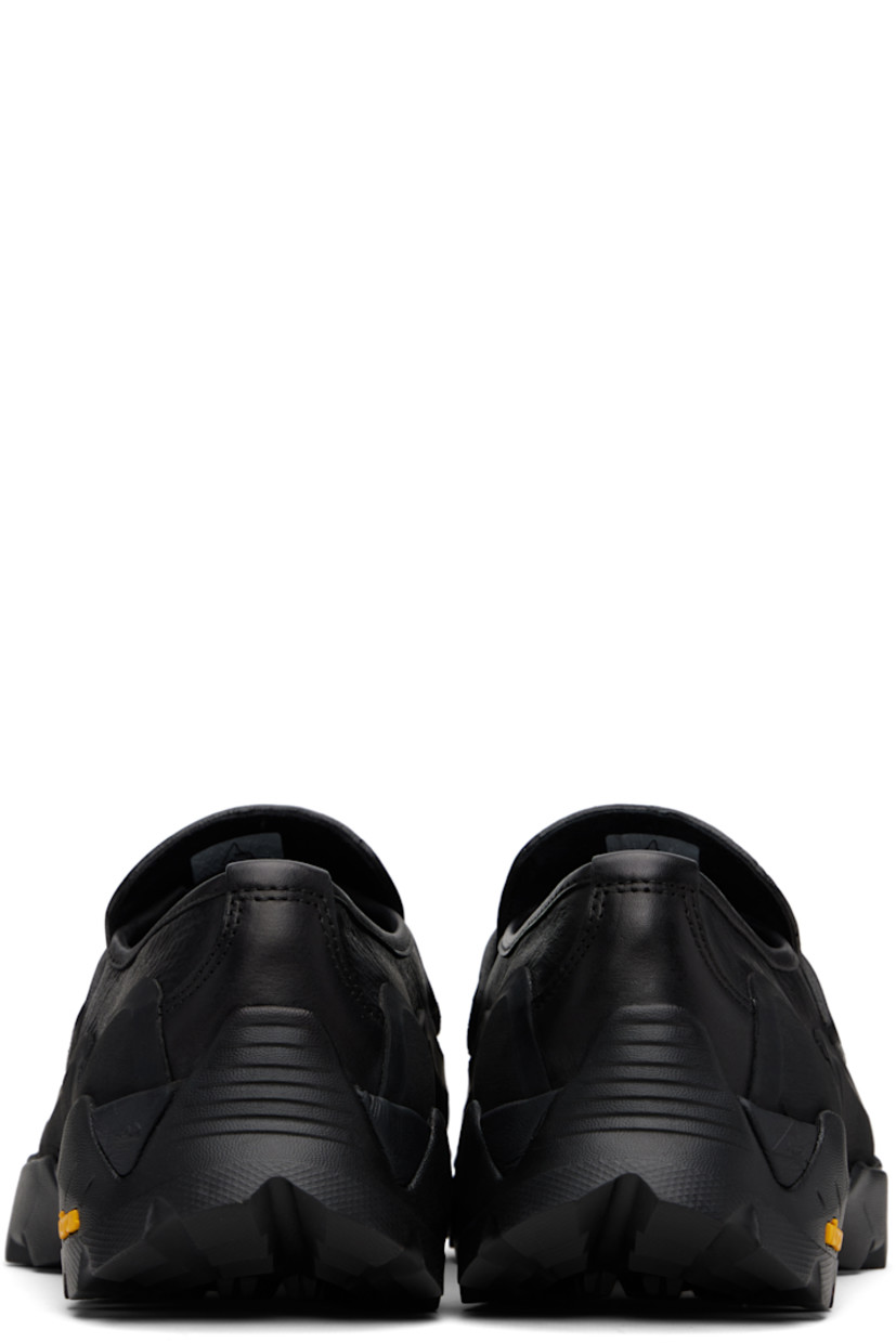 Buffed calfskin loafers.

· Logo printed at rubber cap toe
· Moc toe
· Strap with logo cutout at vamp
· Suede lining
· Rubberized trim at welt
· Treaded Vibram® Megagrip rubber sole

Supplier color: Black