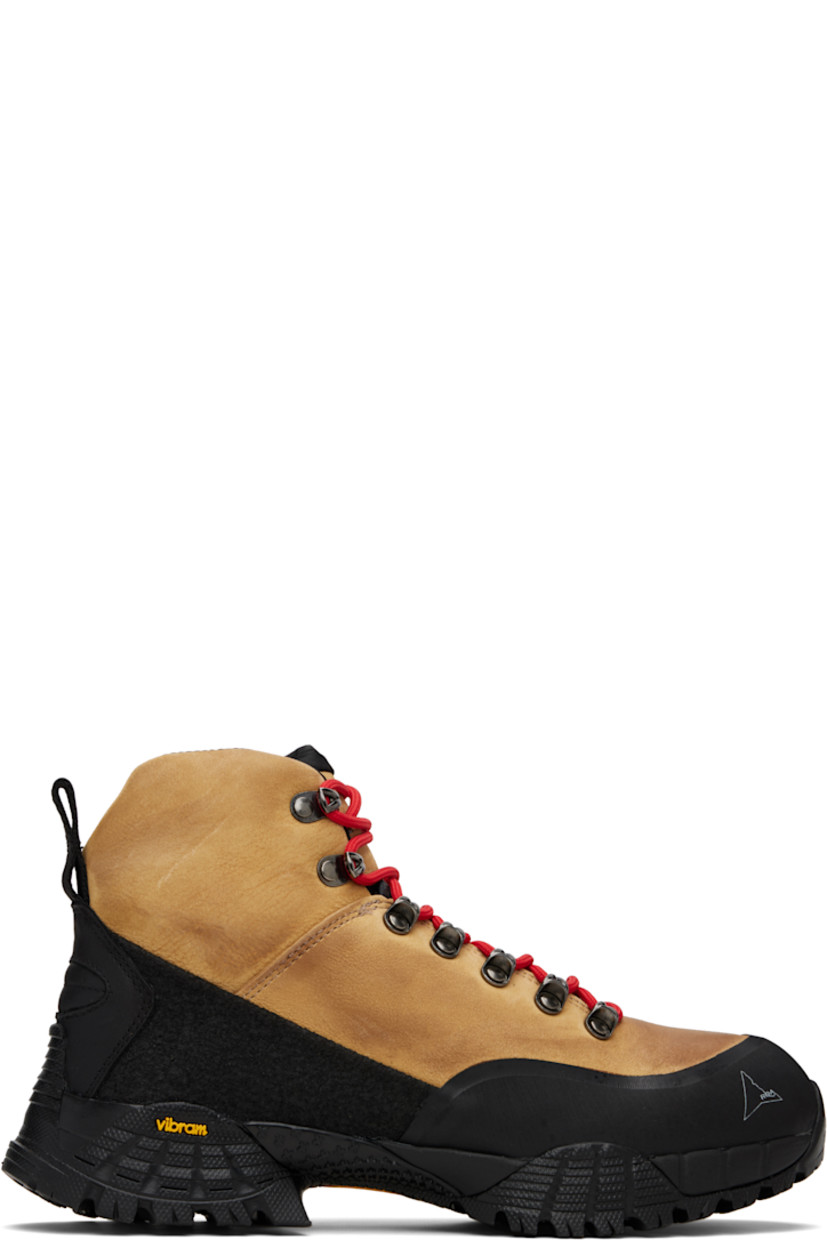 Ankle-high water-repellent kudu leather nubuck boots.

· LWG-certified leather
· Logo printed at rubber cap toe
· Lace-up closure
· Logo embroidered at tongue and inner side
· Padded tongue and collar
· Pull-loop at heel tab
· Jersey lining
· Treaded Vibram® Megagrip rubber sole
· Includes alternate laces

Supplier color: Honey