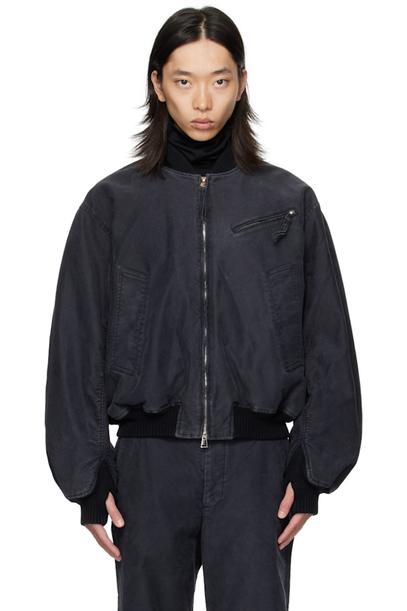 Cotton twill bomber jacket.

· Fading throughout
· Rib-knit stand collar, hem, and cuffs
· Two-way zip closure
· Zip pocket at chest
· Welt pockets at front
· Thumbhole at cuffs
· Flap pocket at back yoke
· Welt pockets at interior
· Full twill lining

Supplier color: Black