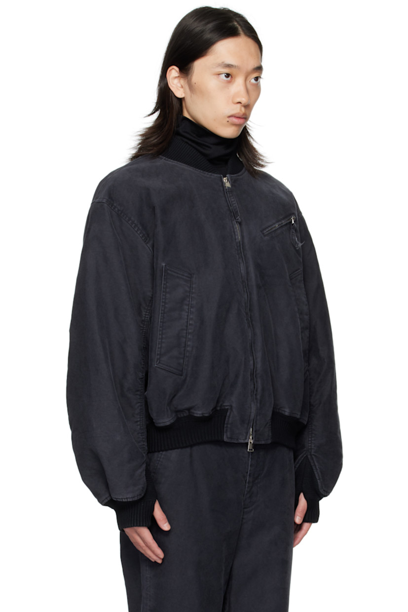 Cotton twill bomber jacket.

· Fading throughout
· Rib-knit stand collar, hem, and cuffs
· Two-way zip closure
· Zip pocket at chest
· Welt pockets at front
· Thumbhole at cuffs
· Flap pocket at back yoke
· Welt pockets at interior
· Full twill lining

Supplier color: Black