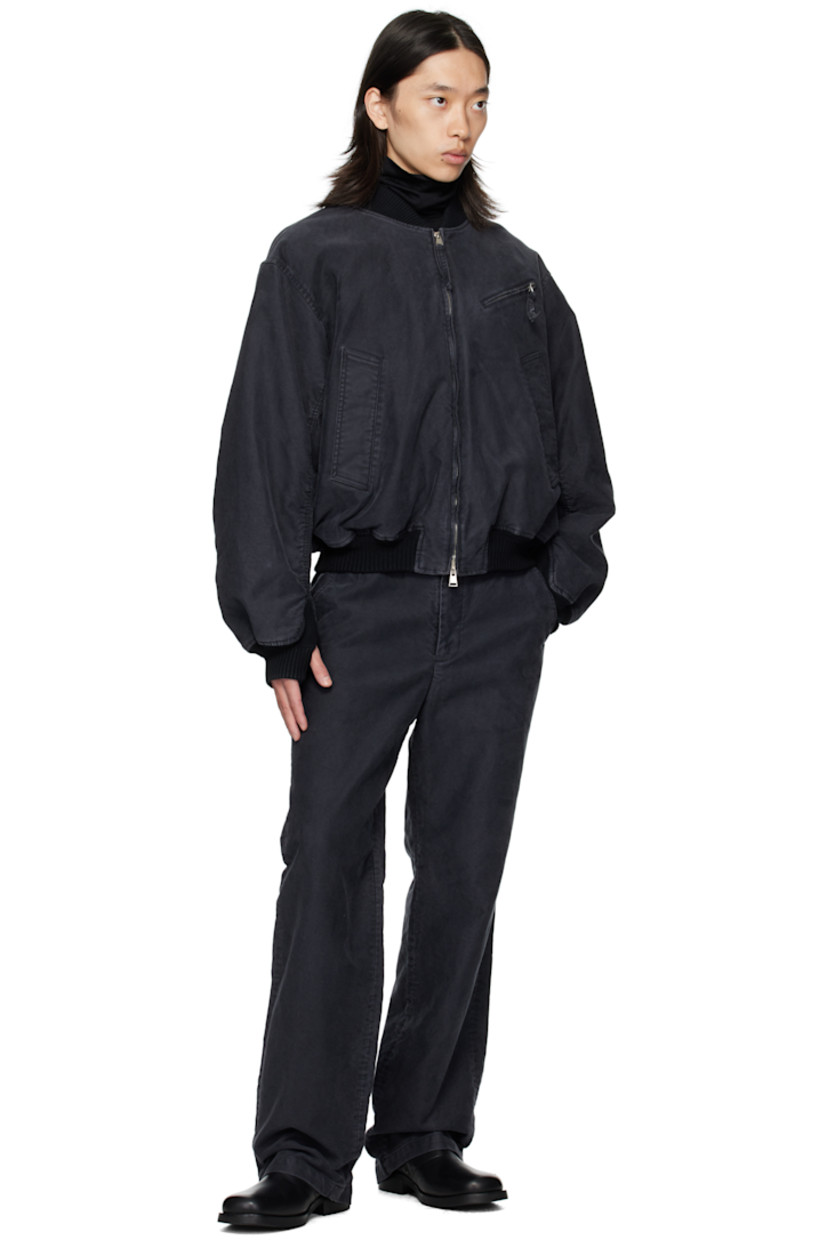 Cotton twill bomber jacket.

· Fading throughout
· Rib-knit stand collar, hem, and cuffs
· Two-way zip closure
· Zip pocket at chest
· Welt pockets at front
· Thumbhole at cuffs
· Flap pocket at back yoke
· Welt pockets at interior
· Full twill lining

Supplier color: Black