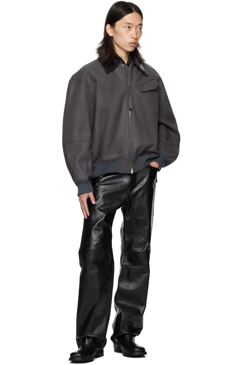 Wool melton jacket.

· Grained leather spread collar
· Two-way zip closure
· Flap pocket at chest and back yoke
· Seam pockets at waist
· Rib-knit hem and cuffs
· Welt pockets at interior
· Full twill lining

Supplier color: Concrete