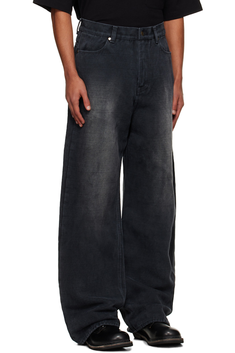 Non-stretch cotton- and jute-blend selvedge denim jeans. 

· Fading throughout 
· Belt loops
· Four-pocket styling
· Zip fly 
· Grained leather appliqués at back waistband

Supplier color: Faded black