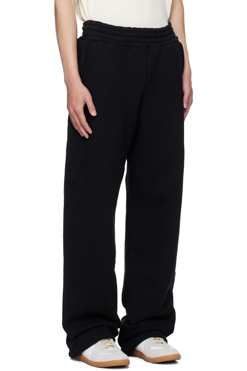 Stretch cotton French terry sweatpants.

· Concealed drawstring at elasticized waistband
· Four-pocket styling

Supplier color: Black