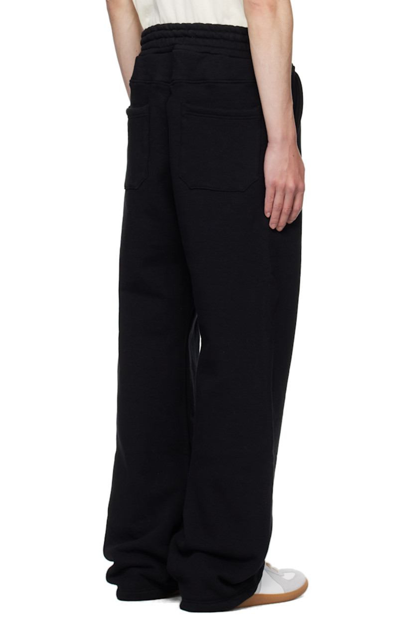 Stretch cotton French terry sweatpants.

· Concealed drawstring at elasticized waistband
· Four-pocket styling

Supplier color: Black