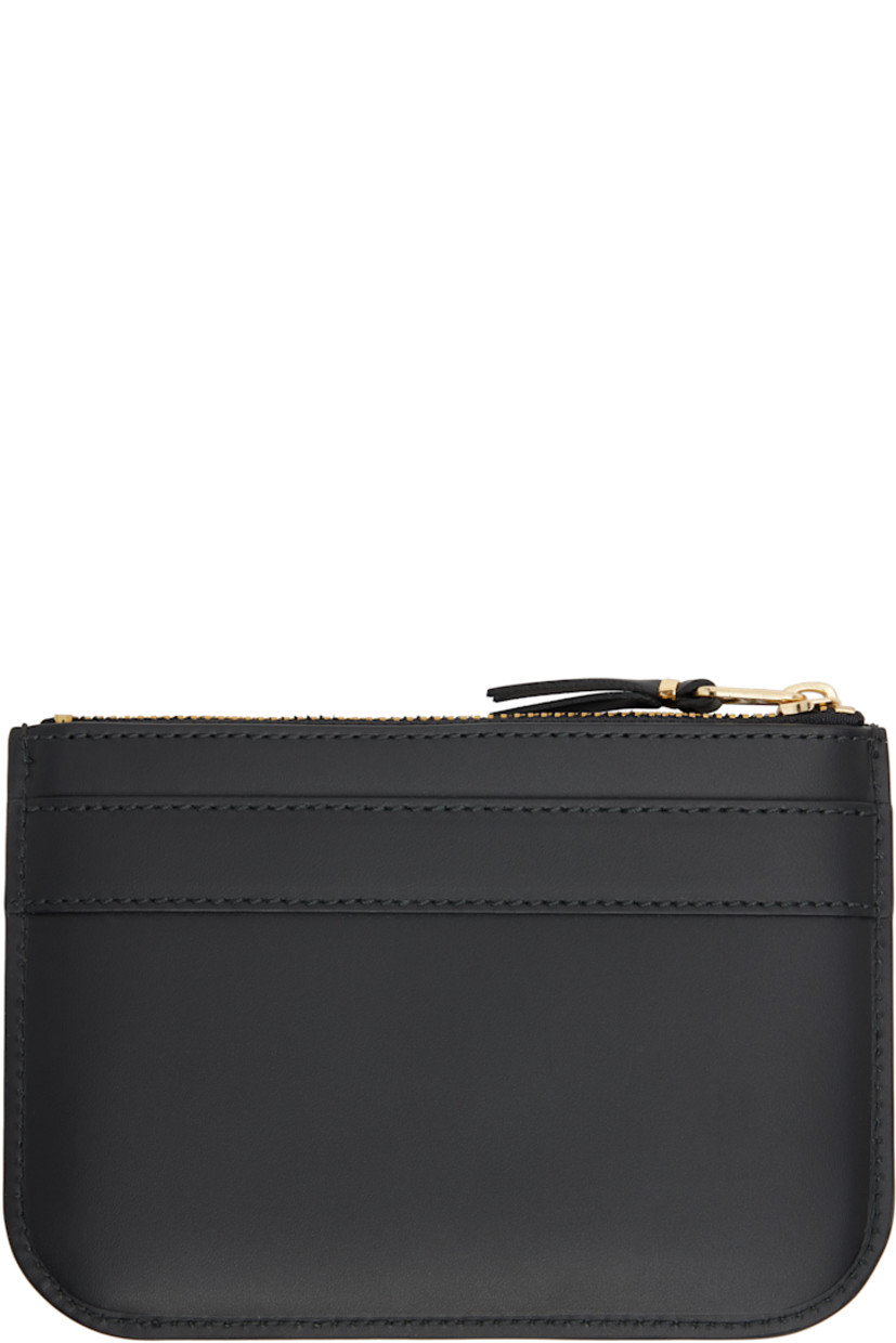 Buffed leather wallet in black.

· Logo stamp and bow accent at face
· Zip closure
· Grained leather lining
· H4.25" x W6"

Supplier color: Black