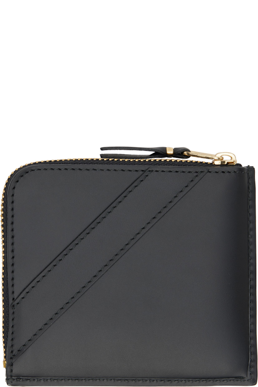 Buffed leather wallet in black. 

· Bow accent at face 
· Zip closure 
· Central note slot at interior
· Buffed leather lining
· H4" x W4.5" 

Supplier color: Black